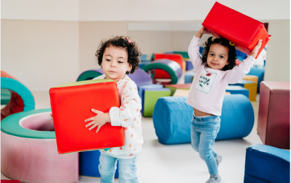 toddlers playing with blocks